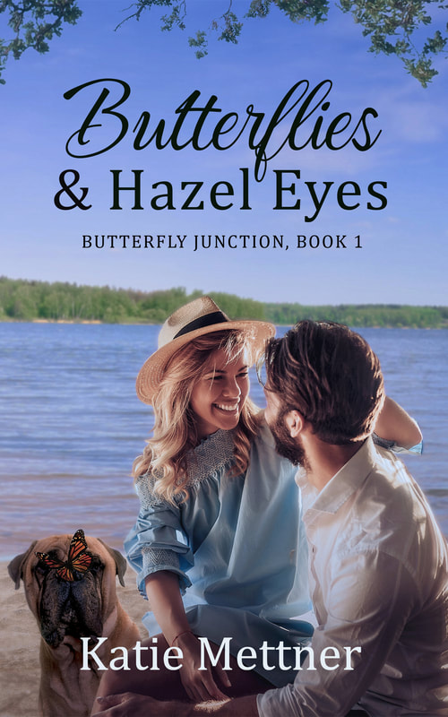A small blonde woman sits on a dark-haired man's lap, smiling. Beside them is a dog with a butterfly on its nose. Behind them is Lake Superior. It says, "Butterfly Junction Book 1," "Butterflies and Hazel Eyes," and "Katie Mettner".