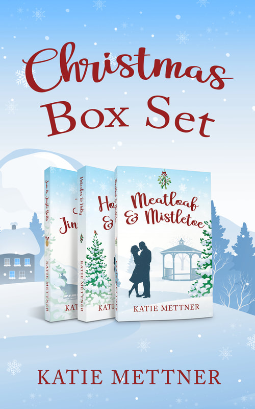 The background is an illustrated Christmas town scene with snowflakes falling. The top says, Christmas box set II. Katie Mettner. In the center are three paperbacks for  Meatloaf and Mistletoe, Hotcakes and Holly, and Jam and Jingle Bells