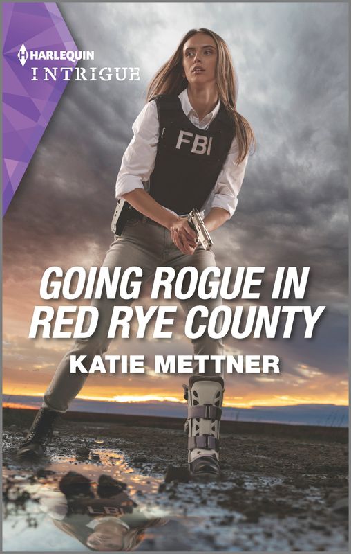 A female FBI agent wears a tactical vest and holds a gun. She has a brace on her left foot. It says: "Harlequin Intrigue," "Going Rogue in Red Rye County," and "Katie Mettner".