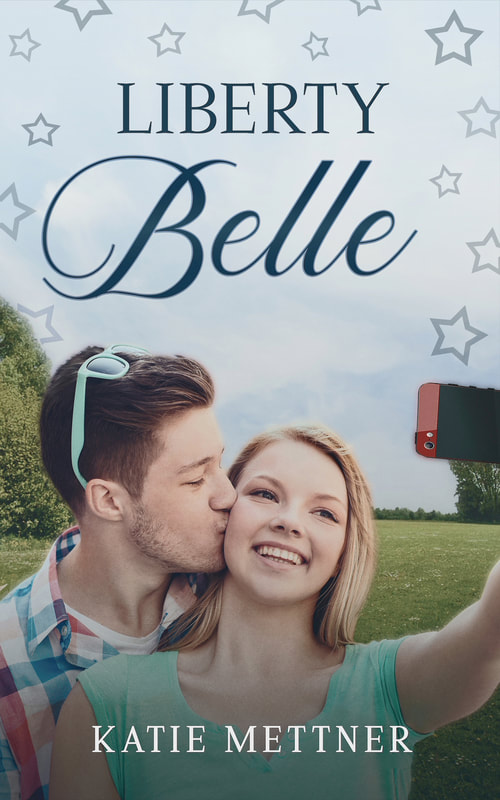 The background is a park in the summer time. There is a couple on the front. The girl is wearing a green shirt and has long blonde hair. She is holding up a cell phone to take a selfie. The man is behind her and is kissing her cheek. He is wearing a plaid button up shirt and sunglasses. It says, "Liberty Belle, Katie Mettner"