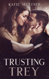 There is a couple embracing wrapped in a brown blanket. The background is a window with snow falling outside. It says, "Trusting Trey, Katie Mettner"