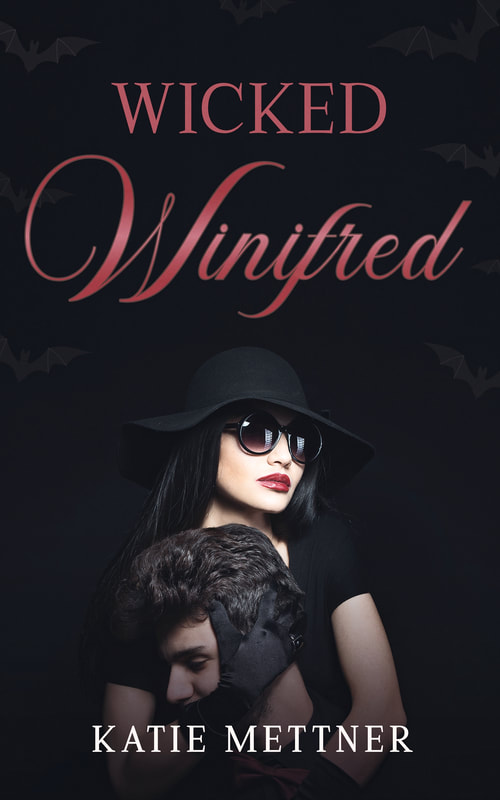 There is a couple embracing against a black background. She is wearing all black, has a black hat, and black gloves. She is holding the man from behind and covering the side of his face with her glove. She is wearing bright red lipstick. It says, "Wicked Winifred, Katie Mettner"