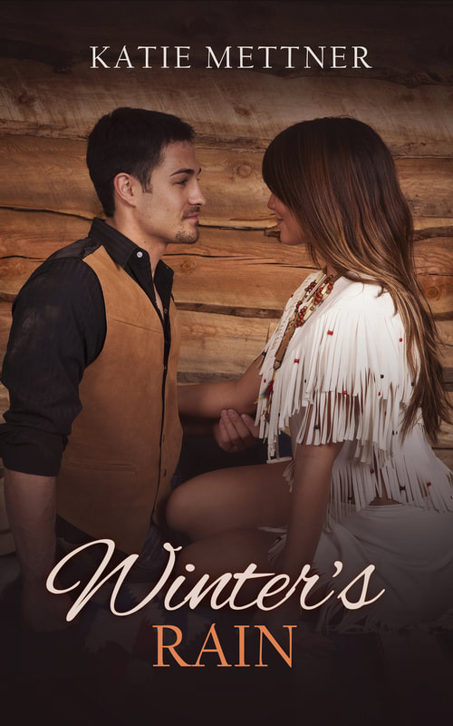 The couple is kneeling and looking at each other against the backdrop of a log cabin. He is wearing a black shirt with a brown vest. She is wearing a white fringe dress and has long dark hair. It Says, "Winter's Rain, Katie Mettner"